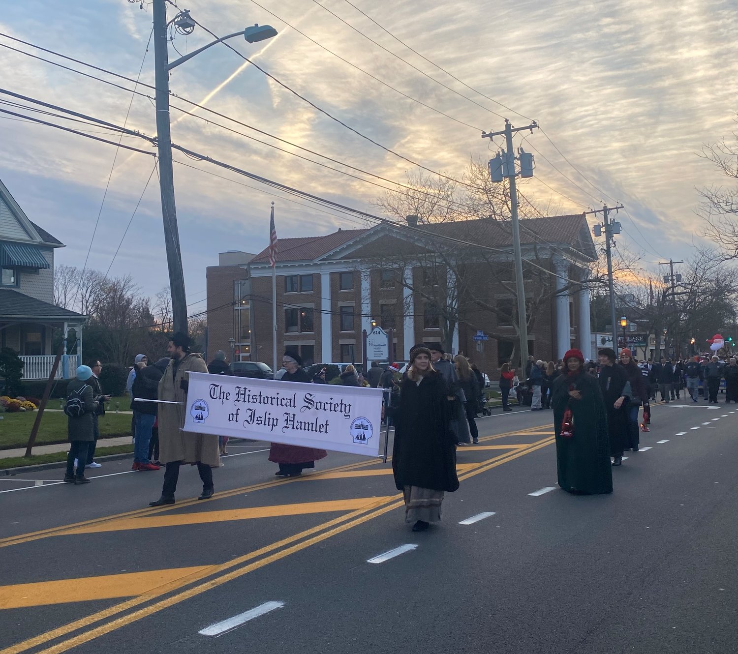 Members of The Historical Society of Islip Hamlet march in the parade.